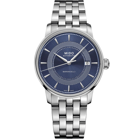 The MIDO Baroncelli II Signature Gent Automatic 39mm watch features a stainless steel case, blue dial, silver hour markers, a date window at 3 o'clock, Nivachron balance-spring for precision, and a classic link bracelet.