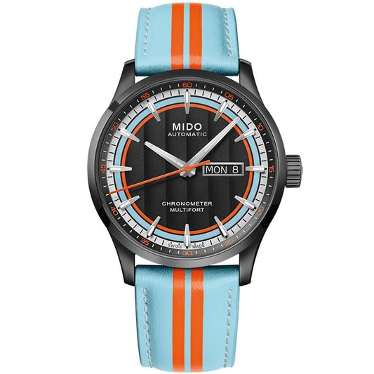 The MIDO Multifort Chronometer 1 Racer Automatic 42mm features a black dial with white markers, a blue and orange striped leather strap, "MIDO" and "Automatic" on the face, Caliber 80 SI movement, and day/date display as "MON 8".