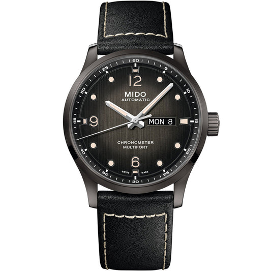 The MIDO Multifort M Chronometer Automatic 42mm features a black dial with white markers, day and date display at 3 o'clock, and a black leather strap with contrasting white stitching. COSC certified.