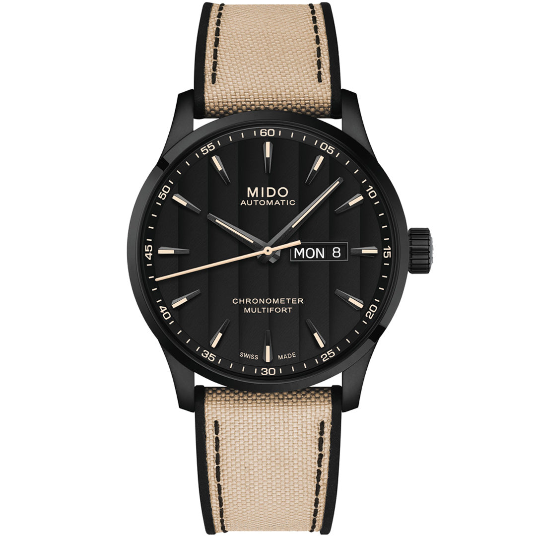 The MIDO Multifort Chronometer 1 Automatic 42mm Watch features a black dial, luminous hands and markers, day-date display, black case, beige fabric strap with black stitching, and is powered by the precise Caliber 80 automatic movement.