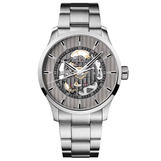 The MIDO Multifort Skeleton Vertigo Automatic 42mm Watch features a stainless steel bracelet, skeleton dial with vertical stripes, and is powered by the Caliber 80 movement for precision.