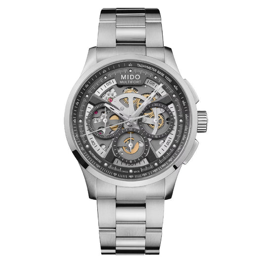 The MIDO Multifort Skeleton Chronograph Automatic 43mm Watch features a stainless steel case, silver metal band, skeleton dial with exposed gears, multiple subdials, tachymeter markings, and Swiss automatic movement.