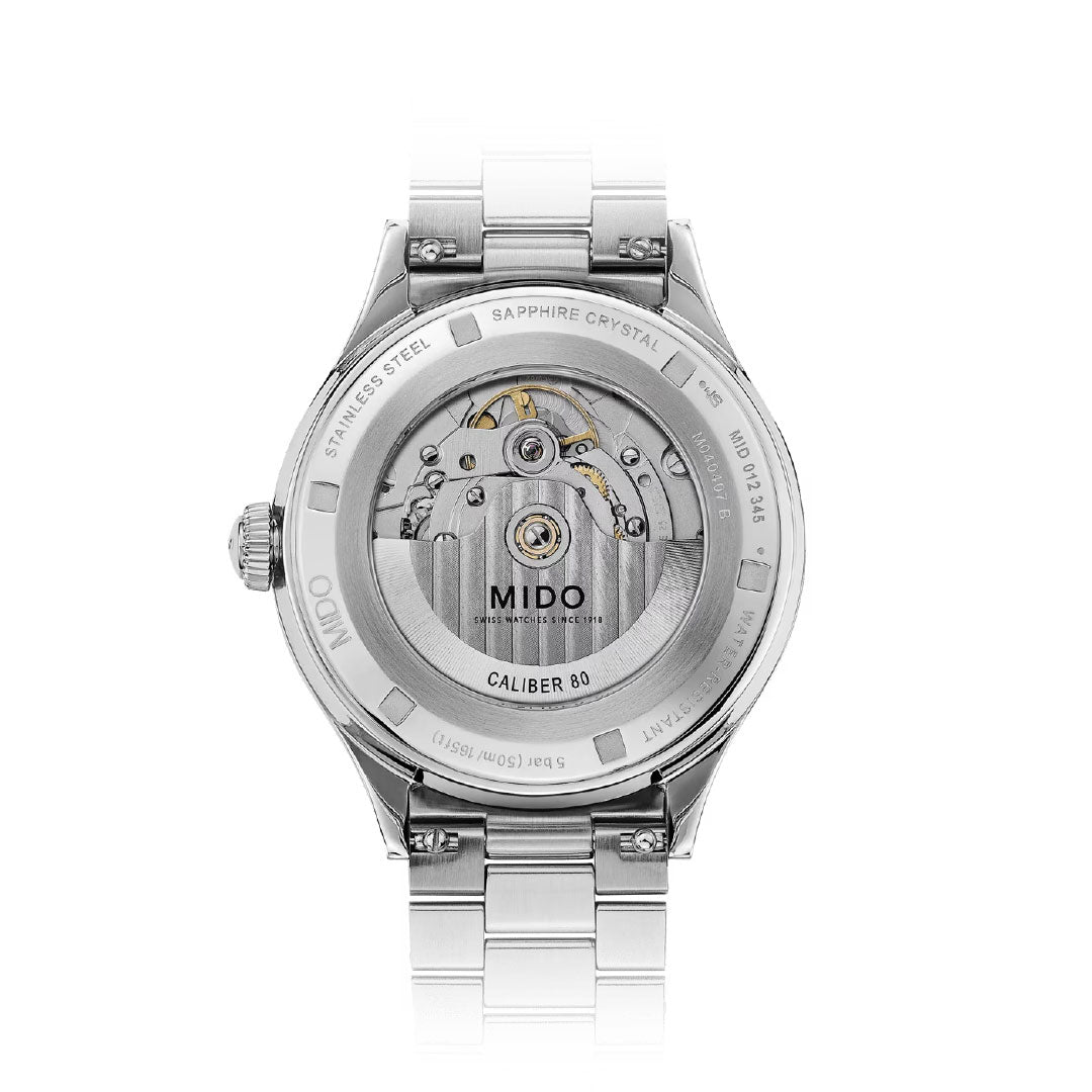 The image shows the back of the MIDO Multifort Patrimony Powerwind Automatic 40mm Watch, featuring a stainless steel bracelet and sapphire crystal case back that displays its intricate Swiss automatic movement and "Caliber 80" engraving.
