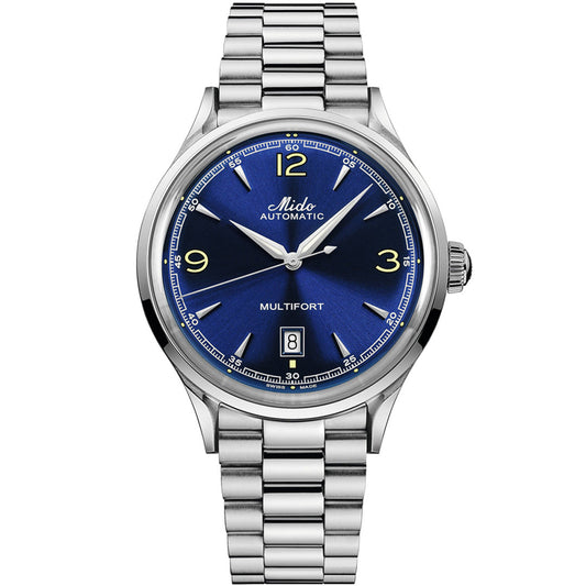The MIDO Multifort Powerwind Automatic 40mm watch features a stainless steel band, blue dial, silver hands, yellow hour markers at 3, 6, 9, and 12 o'clock, a date window at 6 o'clock, and "Mido Automatic" on the face.