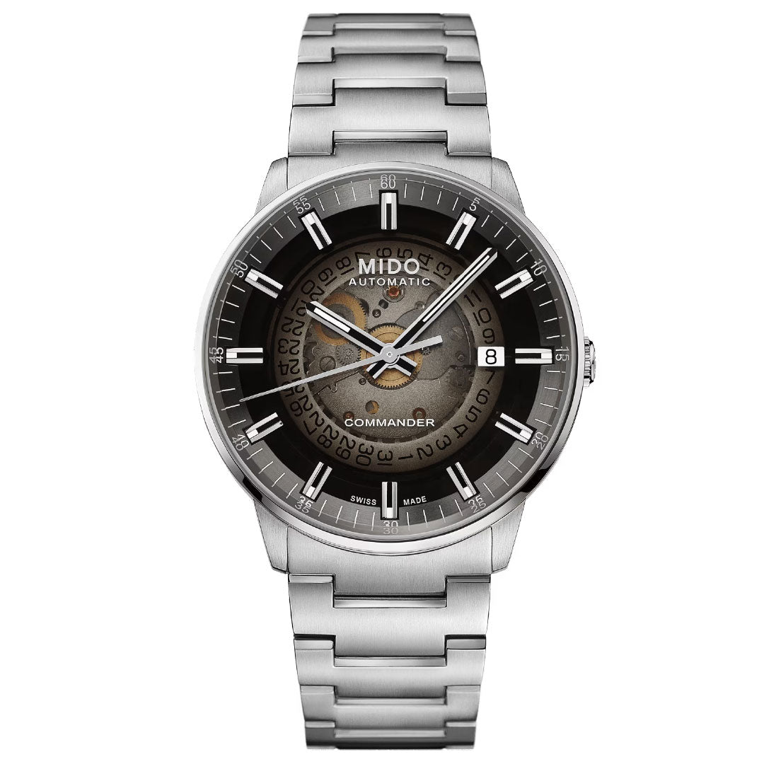 The MIDO Multifort Patrimony Chronograph Automatic 42mm Watch features a round black and gray dial, date window at 3 o’clock, exposed center gears, and is inspired by the classic Multichrono 1937 chronograph.