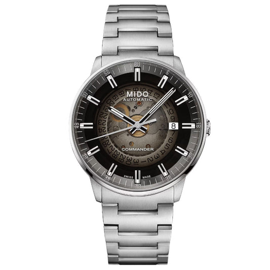 The MIDO Multifort Patrimony Chronograph Automatic 42mm Watch features a round black and gray dial, date window at 3 o’clock, exposed center gears, and is inspired by the classic Multichrono 1937 chronograph.