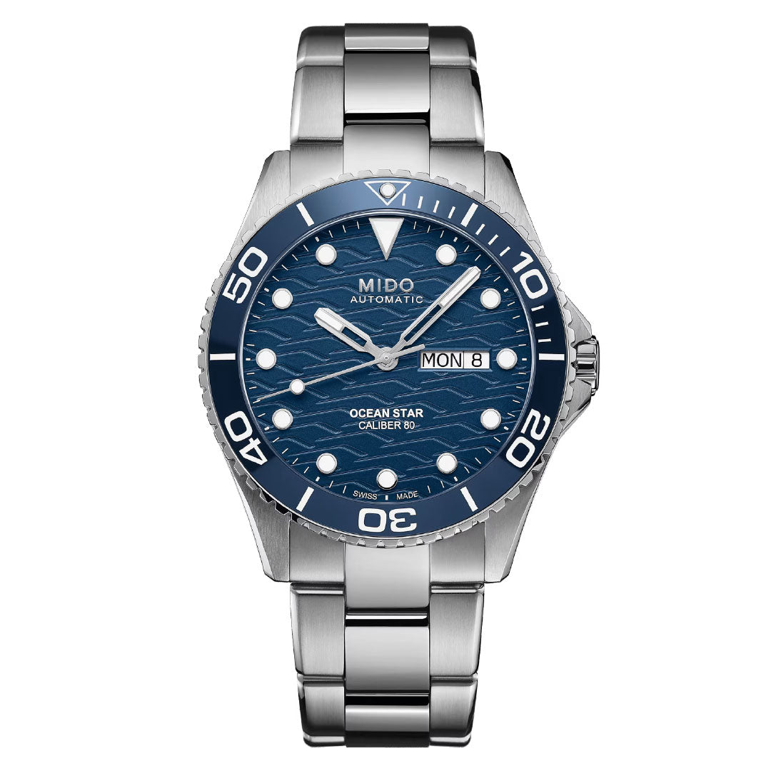 The MIDO Ocean Star 200C Automatic 42.5mm Watch features a blue wave-patterned dial with luminous markers, day/date at 3 o'clock, stainless steel bracelet, and automatic movement.