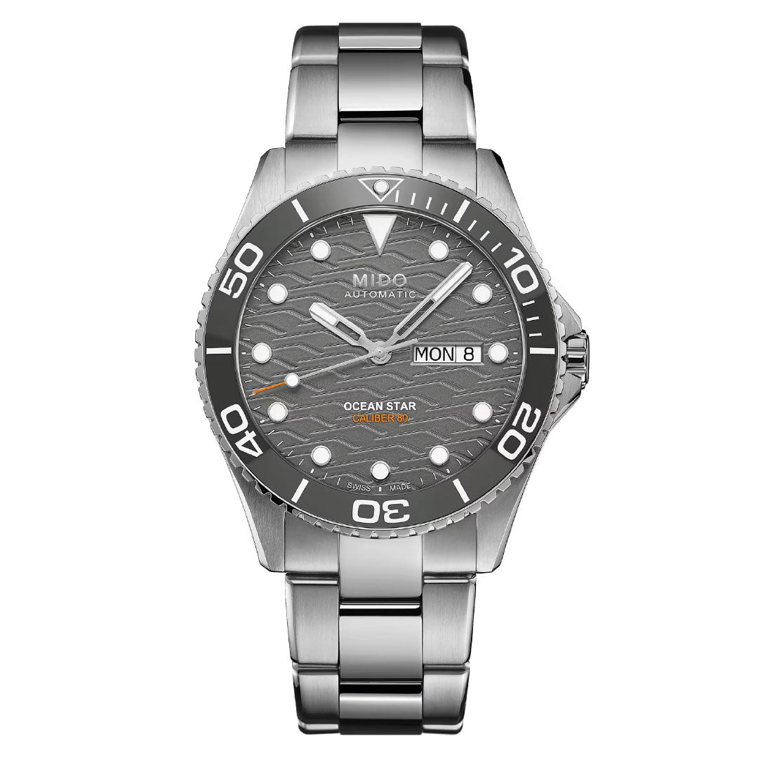 The MIDO Ocean Star 200C Automatic 42.5mm Watch features a silver metal bracelet, ceramic bezel, grey wave-patterned dial, bold white hour markers, automatic movement, and a day-date display at 3 o'clock.