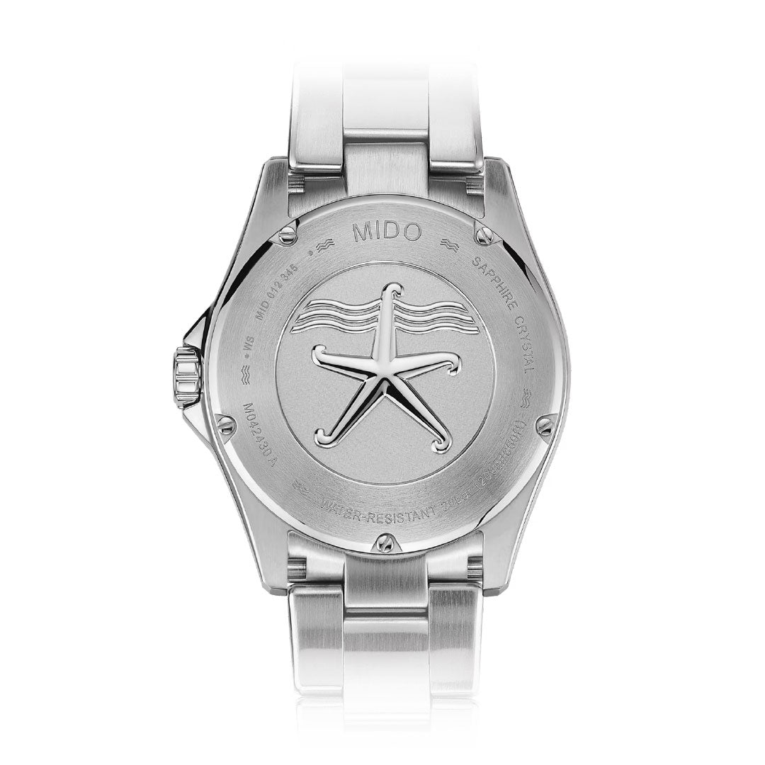 The MIDO Ocean Star 200C Automatic 42.5mm Watch features a stainless steel case back engraved with a starfish logo, wavy lines, and technical details around the edge, highlighting its automatic movement.