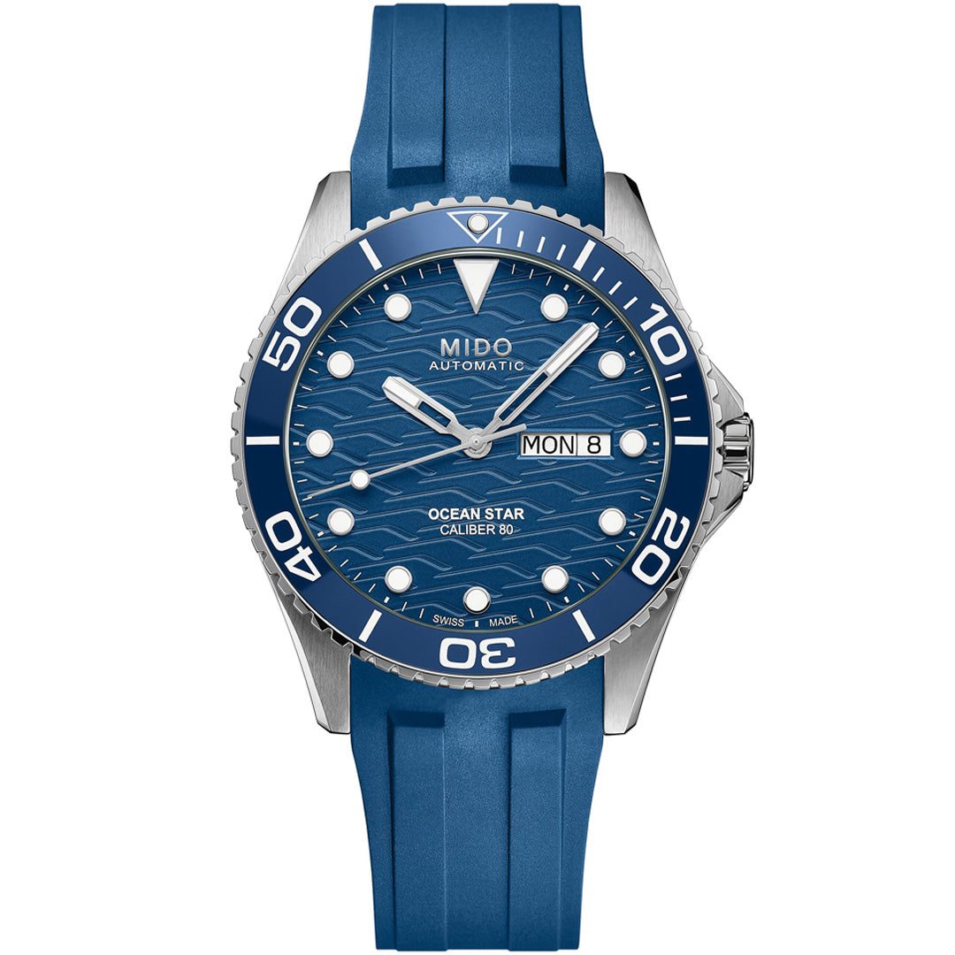 The MIDO Ocean Star 200C Automatic 42.5mm Watch features a blue wave-patterned dial, white hour markers, ceramic bezel, day-date display, and a blue rubber strap.