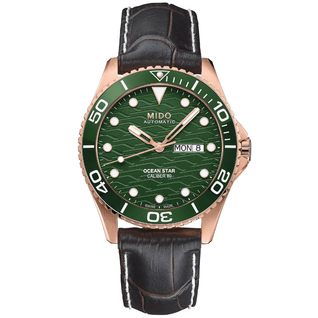 The MIDO Ocean Star 200C Automatic 42.5mm Watch features a green dial, ceramic bezel, rose gold case, black leather strap, and displays day/date with white hour markers and hands.