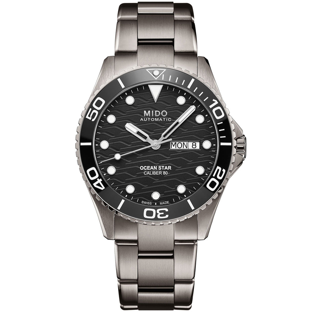The MIDO Ocean Star 200C Automatic 42.5mm Watch features a stainless steel case, black wave-patterned dial with white markers, day-date display, unidirectional bezel, and metal link bracelet, all powered by precise automatic movement.