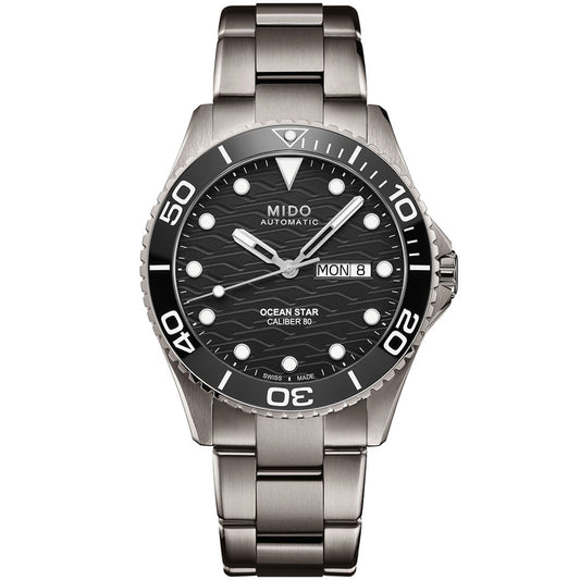 The MIDO Ocean Star 200C Automatic 42.5mm Watch features a stainless steel case, black wave-patterned dial with white markers, day-date display, unidirectional bezel, and metal link bracelet, all powered by precise automatic movement.