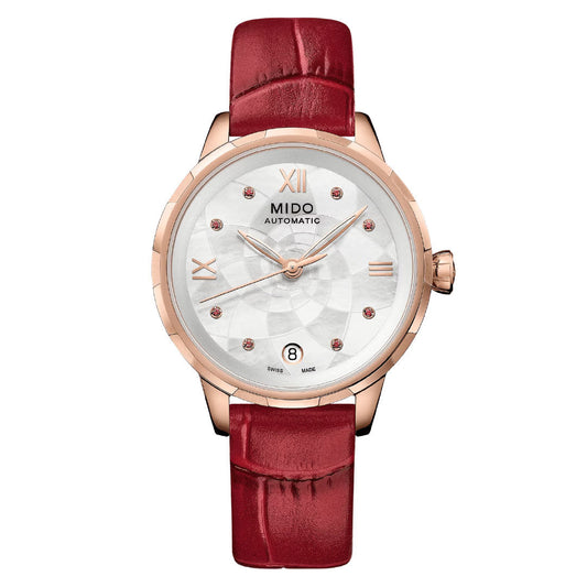 The MIDO Rainflower Automatic 34mm women’s watch features a rose gold case, white textured dial with diamond markers, Roman numerals at 12/3/6/9 o’clock, date at 6 o’clock, and a red leather strap.