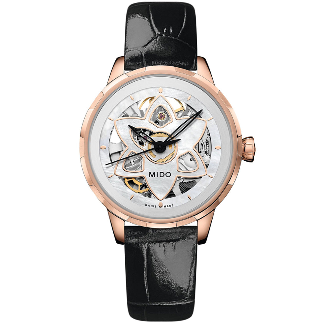 The MIDO Rainflower Blossom Automatic 34mm Watch features a rose gold case, black leather strap, open-worked dial with a geometric design revealing the Caliber 80 movement, and the MIDO logo above 6 o’clock.