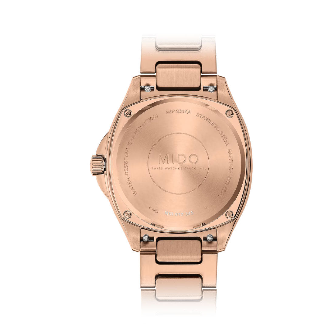 Back view of a MIDO Multifort TV 35 Automatic 35mm Watch in rose gold, featuring a Nivachron balance spring, round case, stainless steel accents, and metal bracelet.
