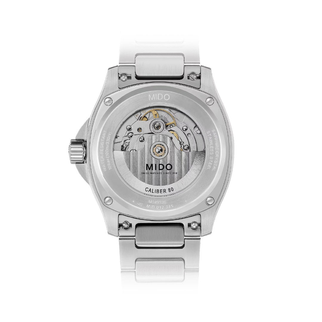 Back view of the MIDO Multifort TV Big Date Automatic 40mm watch in silver, featuring a transparent case back revealing the "CALIBER 80" automatic movement and detailed engravings along the edge.