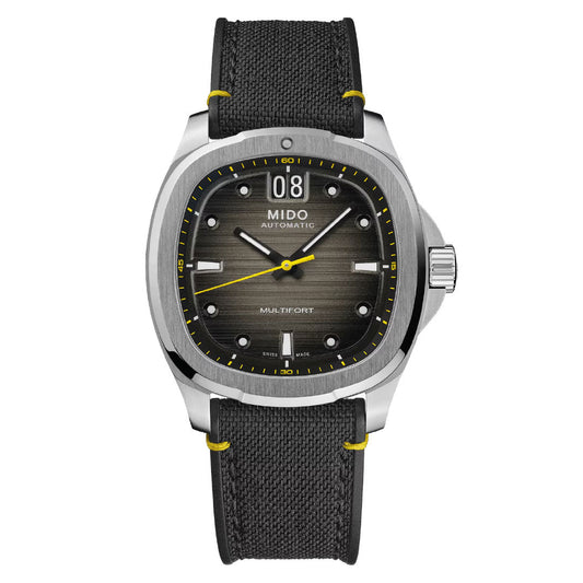 The MIDO Multifort TV Big Date Automatic 40mm watch features a black textured dial, silver markers, large date at 12 o’clock, and a black strap with yellow stitching.