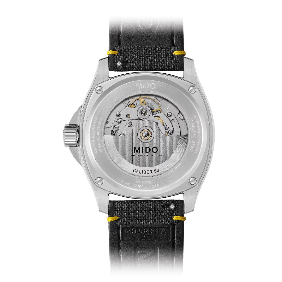 The back of the MIDO Multifort TV Big Date Automatic 40mm Watch features a transparent case back that reveals its automatic movement, engraved stainless steel case, and refined leather strap.