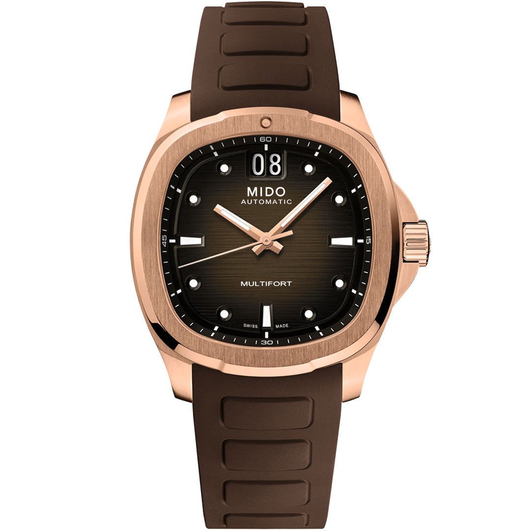 The MIDO Multifort TV Big Date Automatic 40mm Watch features a brown rubber strap, rose gold-tone case, black gradient dial with white hour markers, luminous hands, and a date window at 12 o’clock.