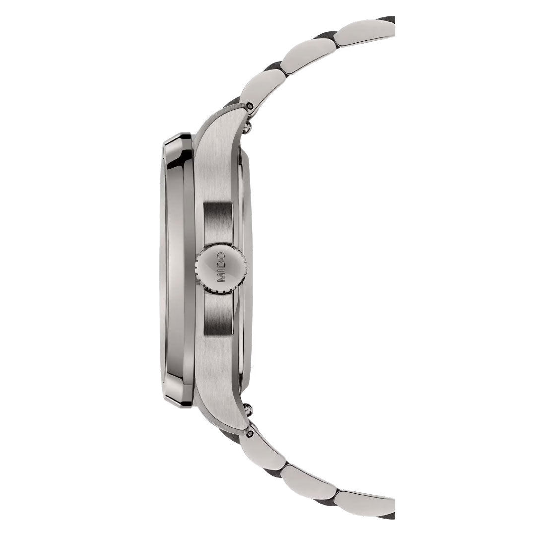 Side view of the MIDO Multifort TV Big Date Automatic 40mm Watch by MIDO, featuring a brushed silver finish, visible crown, and segmented metal bracelet that highlights its automatic movement against a white background.