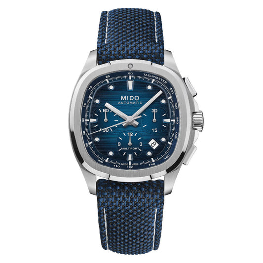The MIDO Multifort TV Chronograph Automatic 42mm Watch features a Swiss automatic Caliber 60 movement, blue textured dial with silver markers, three subdials, date window, and a blue woven strap with white stitching.