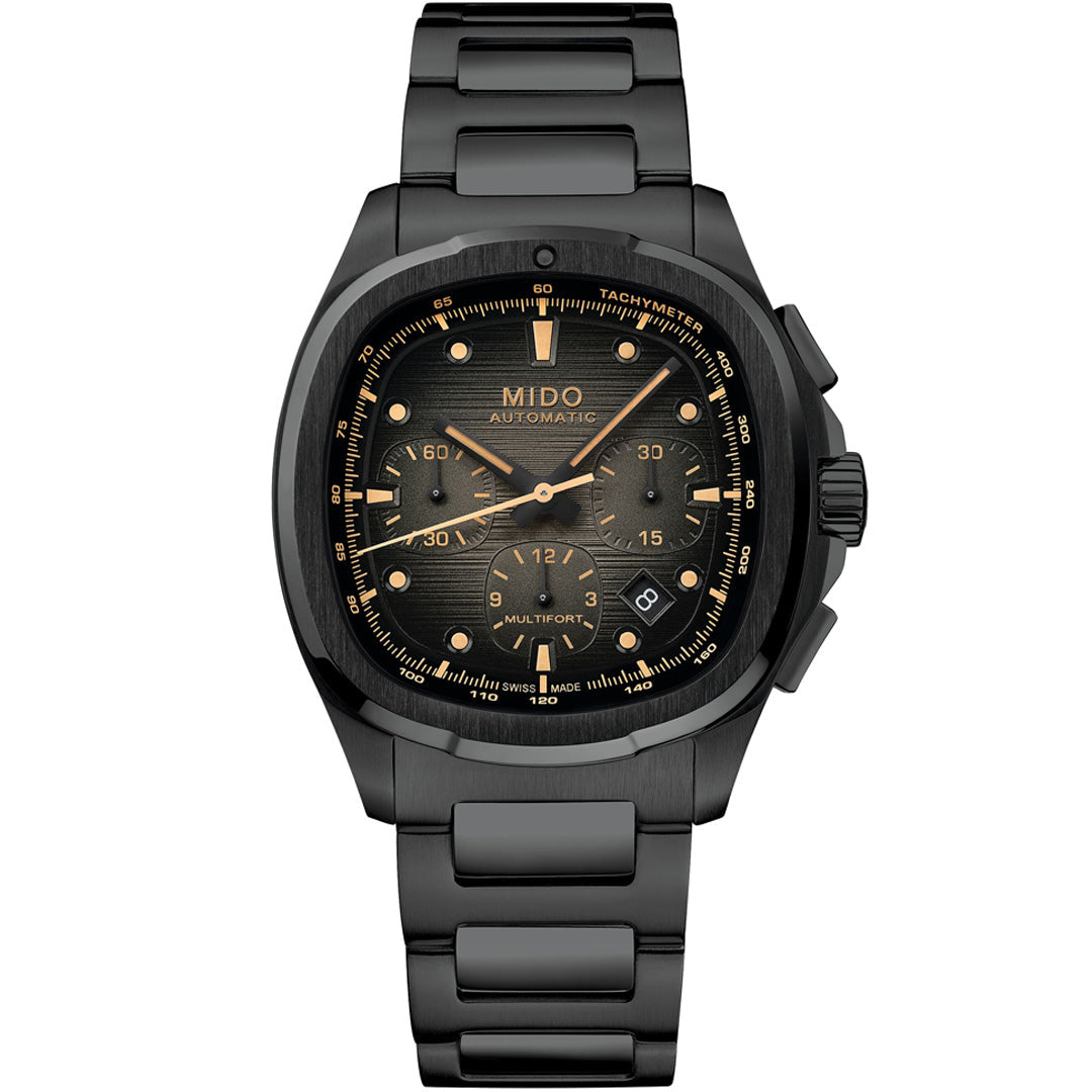 The MIDO Multifort TV Chronograph Automatic 42mm watch features a black dial, metallic bracelet, gold-tone markers and hands, three subdials, a date window at 4 o’clock, and a 60-hour power reserve, shown on a white background.