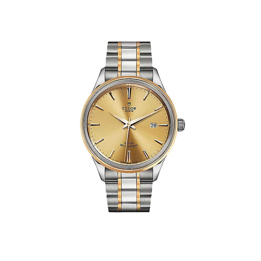 Introducing the New Old Stock TUDOR Style by TUDO1: a silver and gold wristwatch featuring a yellow gold bezel and gold dial, accented with a date display on the right. This watch boasts a two-tone metal band and minimalist design, all complemented by a scratch-resistant sapphire crystal for enduring elegance.