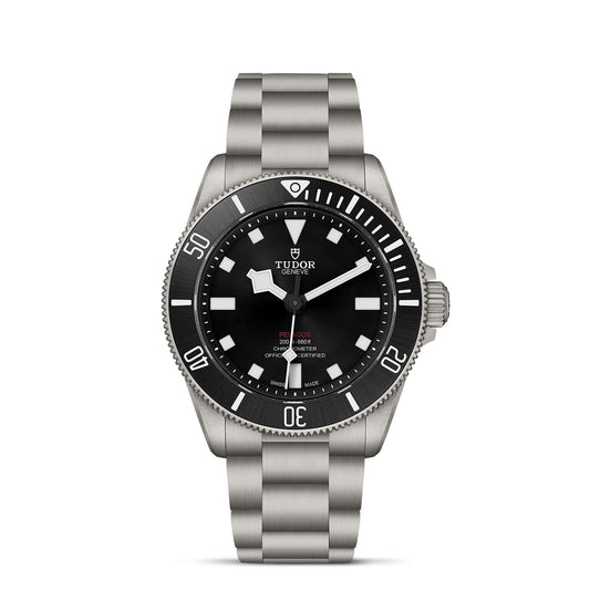 The TUDOR Pelagos 39 is a stainless steel dive watch featuring a black dial and rotating bezel. This sports timepiece includes luminescent hour markers and hands, along with a date display, while the TUDOR logo sits elegantly beneath the 12 o'clock position, enhancing its rugged charm.