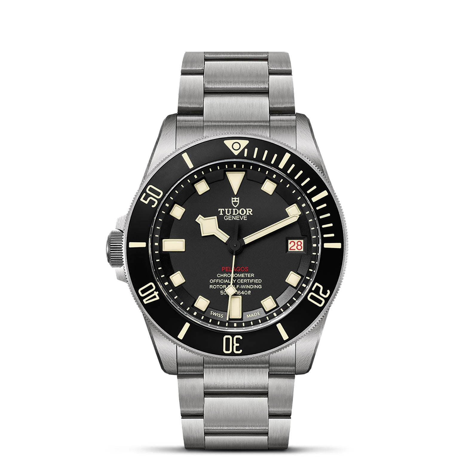 The TUDOR Pelagos LHD is a silver wristwatch with a stainless steel band and black dial, featuring luminous hour markers, a date window at 3 o'clock, and a rotating bezel with minute markings. Reminiscent of military diver watches, the TUDOR brand name and logo are visible on the dial.