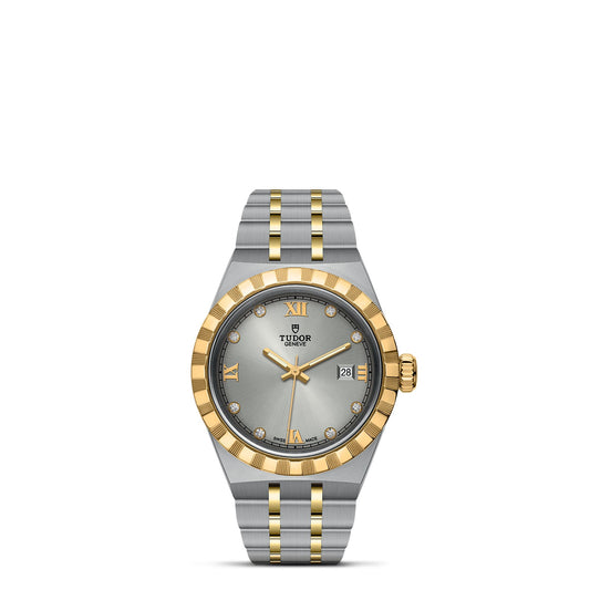 Introducing the TUDOR Royal by TUDOR, a breathtaking two-tone wristwatch featuring an elegant silver and gold design. This automatic sport-chic timepiece boasts a light gray dial adorned with gold Roman numerals and diamond hour markers. Complete with a date display and a sophisticated stainless steel and gold bracelet, it truly embodies elegance.