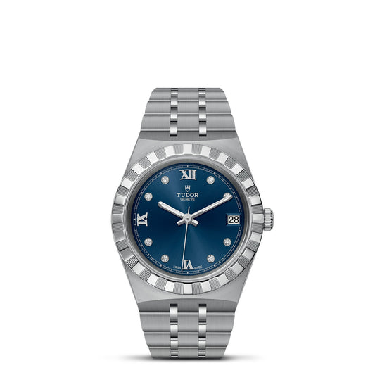 The TUDOR Royal is a sophisticated wristwatch that boasts a silver design with a captivating blue dial, complete with Roman numerals at 12 and 6. It features diamond hour markers and includes a date display at 3 o'clock. Complemented by a fluted bezel, its stainless steel bracelet elegantly combines sport-chic style with timeless elegance.