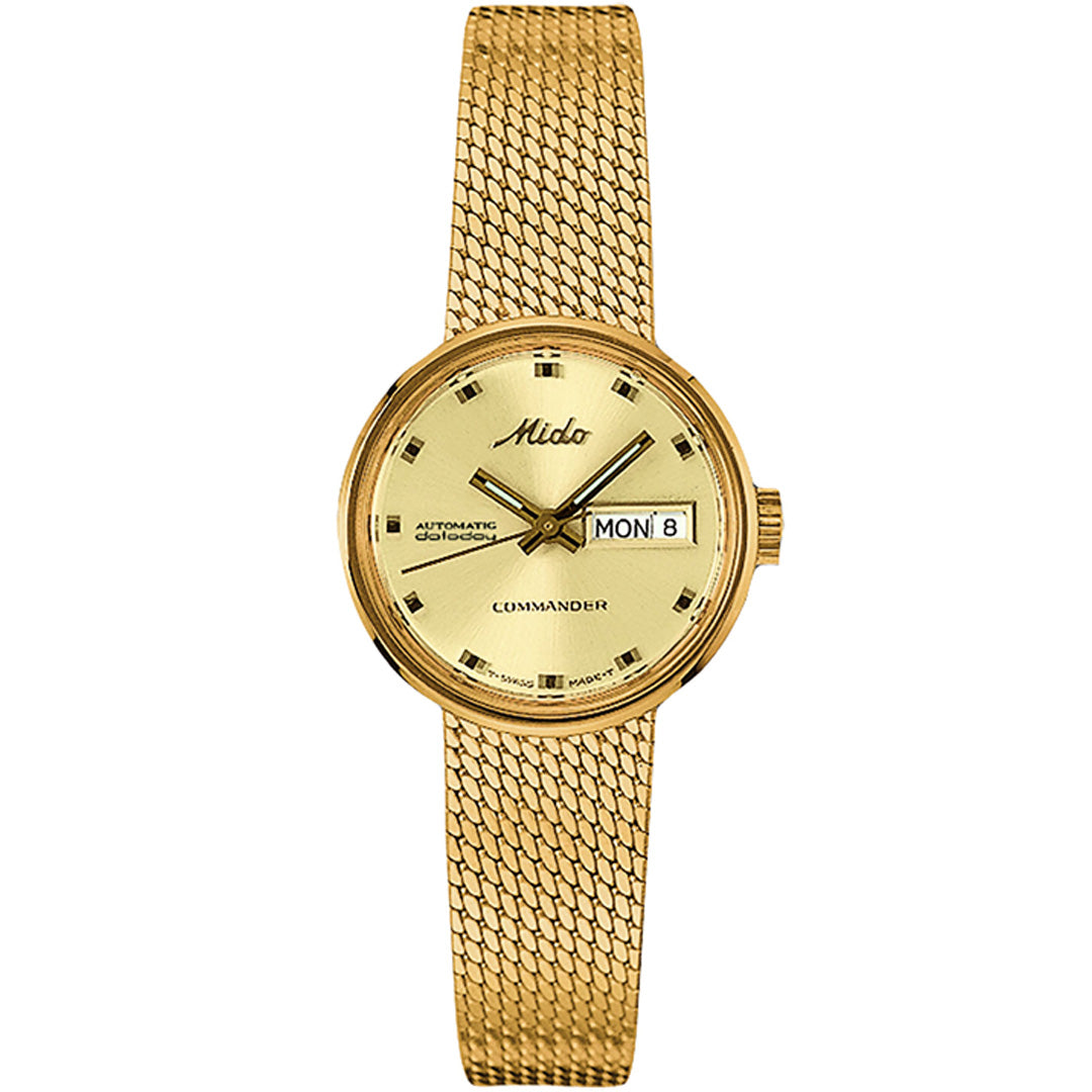 The MIDO Commander 1959 Automatic 23.5mm watch features an integrated gold bracelet, round dial with square hour markers, day/date display at 3 o’clock, and "MIDO," "Automatic," and "Commander" on the face.