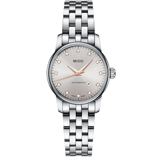 The MIDO Baroncelli II Lady Automatic 29mm Watch features a silver metal link bracelet, round light dial, rose gold hour markers, date at 3 o'clock, and "MIDO AUTOMATIC" text—a refined fusion of elegance and Swiss precision.