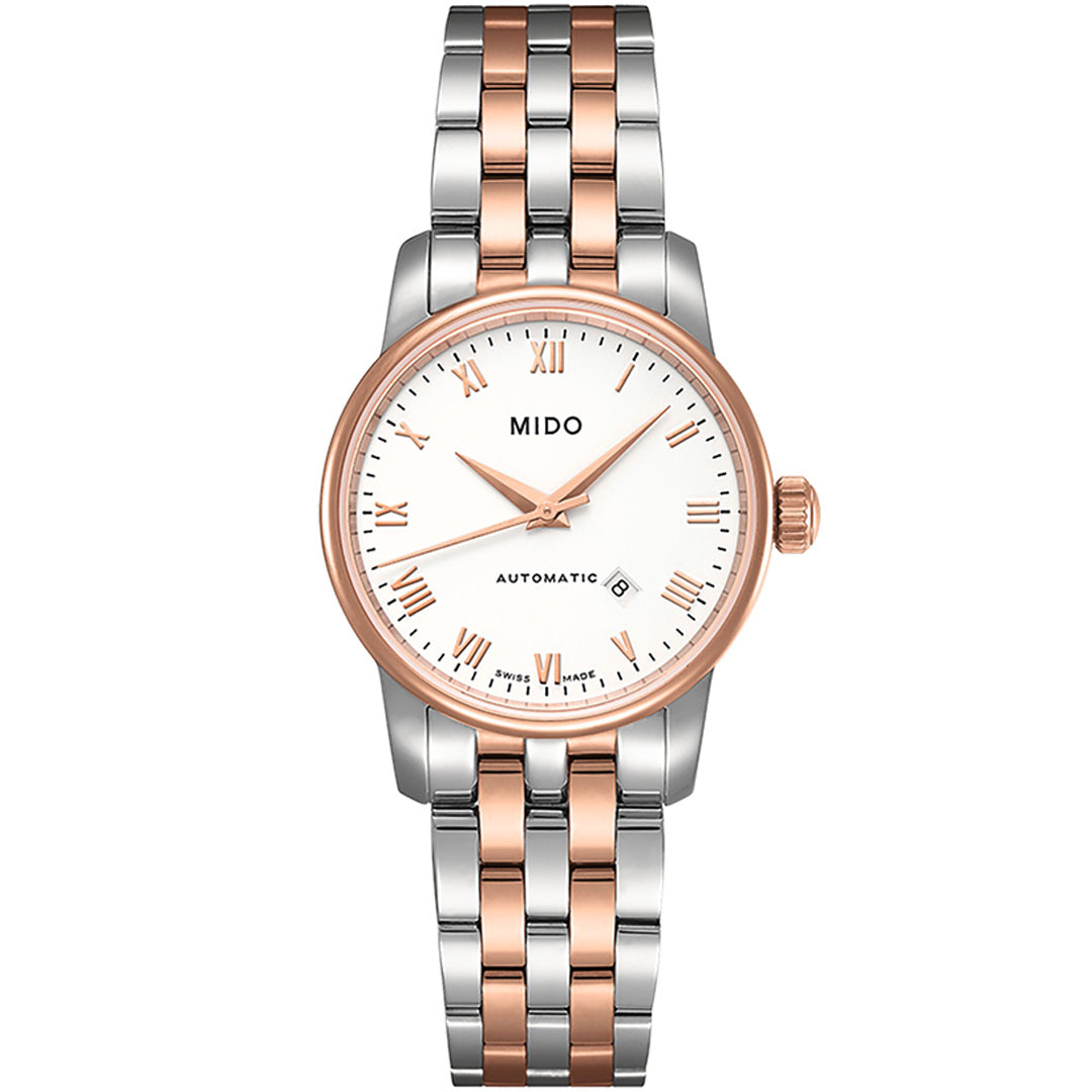 The MIDO Baroncelli II Lady Automatic 29mm Watch features a white dial, rose gold and silver two-tone metal band, Roman numeral hour markers, automatic movement, and a date display at 6 o’clock.
