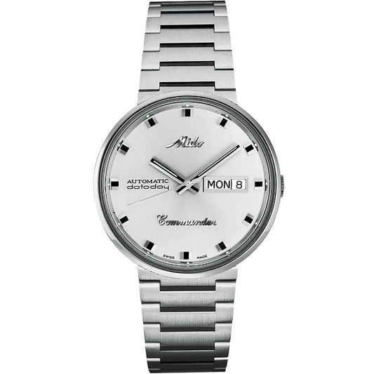 The MIDO Commander 1959 Automatic 37mm watch features a silver integrated bracelet, white dial, black hour markers, silver hands, and a day-date display on the right side.