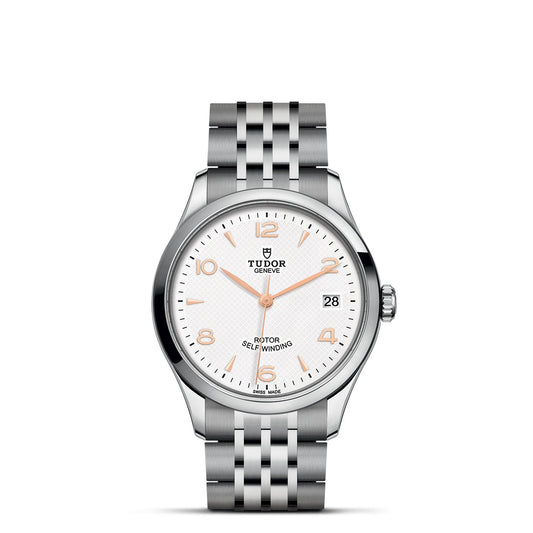 Experience the elegance of the TUDOR 1926 watch, featuring a sophisticated silver stainless steel bracelet and round case. The white dial is elegantly designed with silver hour markers, hands, and a date display at 3 o'clock. This classic piece embodies the sophistication of fine mechanical watches from TUDOR.