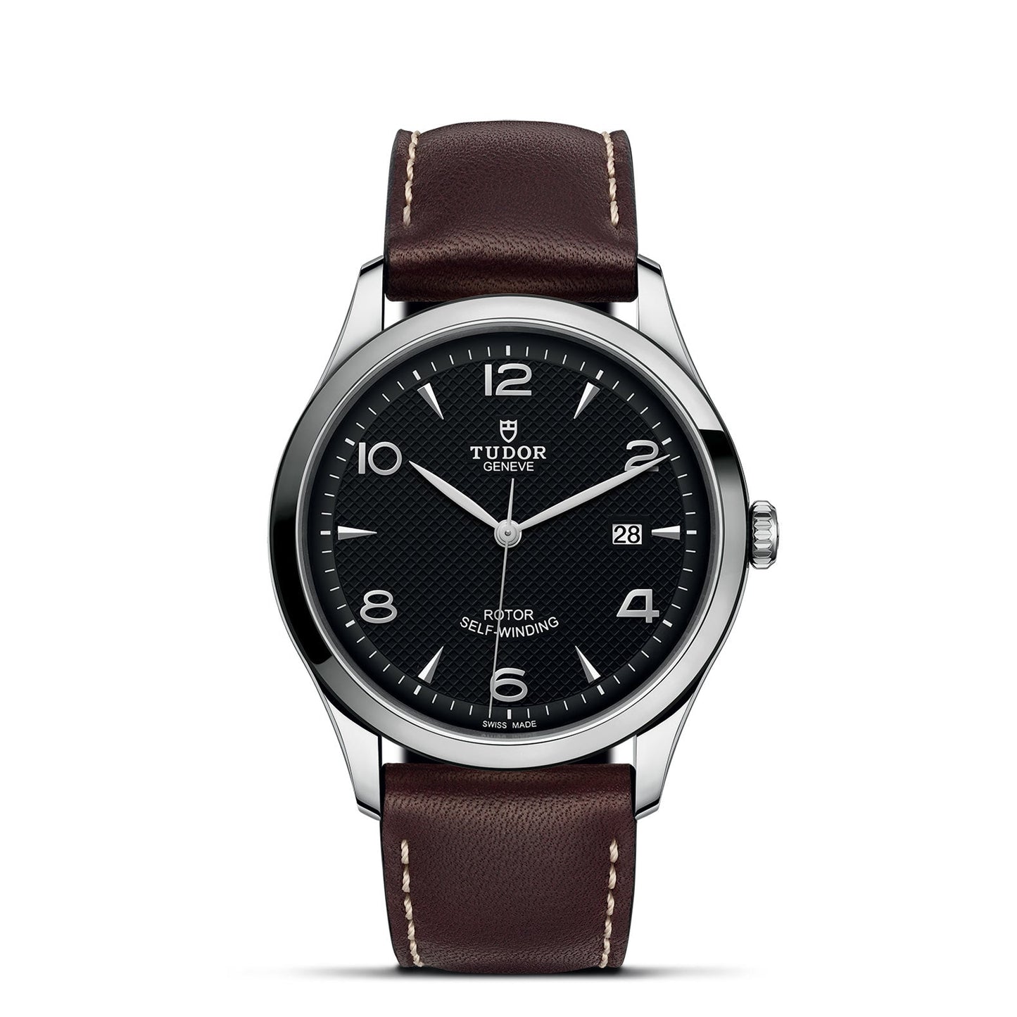 The TUDOR 1926 is a classic watch by TUDOR, featuring a black textured dial with silver hour markers and white hands. It includes a date window at the 3 o'clock position and displays the "Rotor Self-Winding" text. This watch has a stainless steel case and is paired with a brown leather strap accented with white stitching.