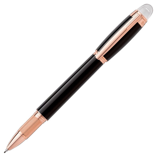 The Montblanc Starwalker Black Resin Rose Gold Plated Rollerball Pen showcases a sleek black design with a smooth glossy finish, highlighted by rose gold accents on the clip, tip, and grip area. The iconic Montblanc emblem is elegantly set against a white background.