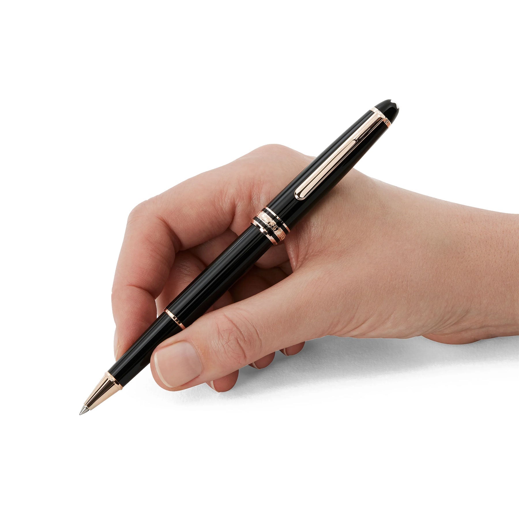 A hand holding a luxurious Montblanc Meisterstück Rose Gold Coated Rollerball Pen, crafted from black precious resin and accented with rose gold, against a pristine white background.