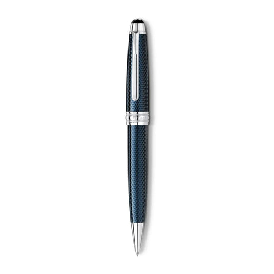 The Montblanc Meisterstuck Solitaire Blue Resin Platinum Plated Ballpoint Pen showcases a striking metallic blue design with a textured hexagon pattern, complemented by silver accents and a clip on the cap. Set against a plain white background, this luxurious pen epitomizes sophistication.