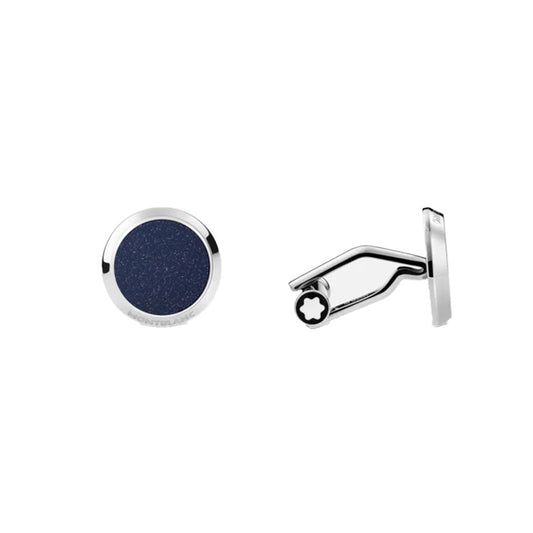 The Montblanc Meisterstück Blue Goldstone & Stainless Steel Cufflinks feature a captivating dark blue goldstone inlay set in round, silver frames. One cufflink displays the front design, while the other highlights the side profile, reflecting Montblanc's signature elegance against a plain white backdrop.