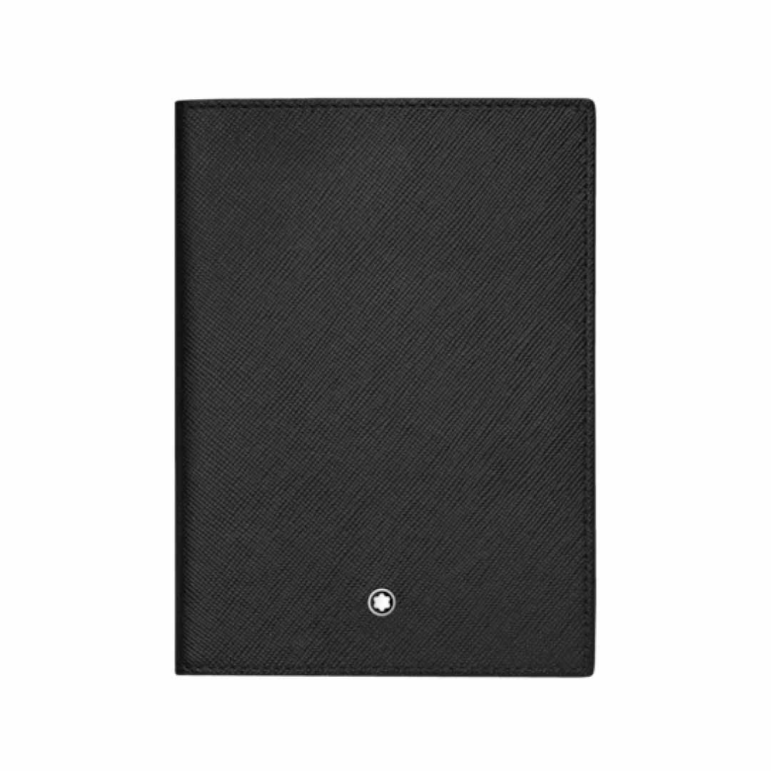The Montblanc Sartorial Black Leather Passport Holder, made from premium Italian full-grain calfskin, showcases a small round silver emblem centered near the bottom. The black textured surface is adorned with a subtle diagonal pattern, elevating its sleek and minimalist design.