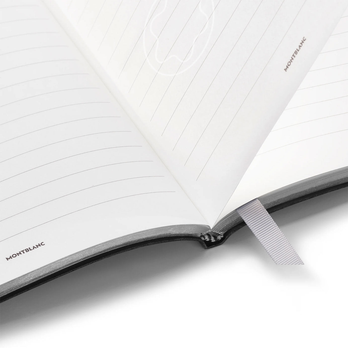 The Montblanc Fine Stationery Black Lined #146 Notebook showcases its lined pages prominently, complemented by the iconic Montblanc emblem and a gray ribbon bookmark. The subtly curved pages highlight a clean and minimalistic design, ideal for discerning fans of finely crafted stationery.