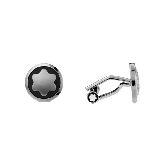 The Montblanc Star Black Onyx and Stainless Steel Cufflinks are round in shape and feature an elegant six-pointed star design. Crafted from stainless steel, they exhibit a sophisticated black and silver color scheme with a polished finish. One cufflink is displayed from the side to showcase the fastening mechanism and the distinctive Montblanc signature for an added touch of elegance.