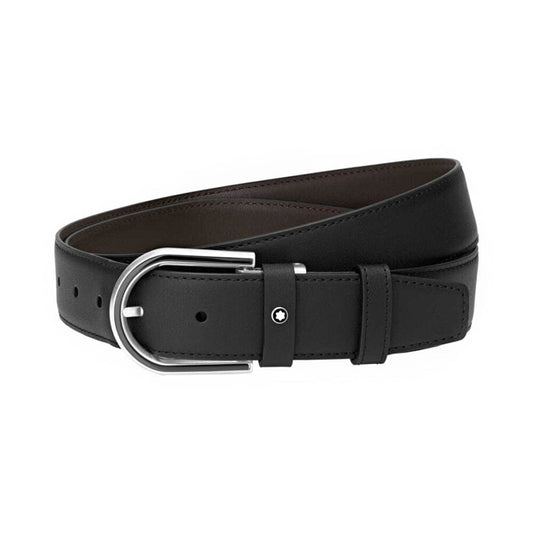 The Montblanc Leather Belt, featuring a smooth texture and sleek design, is elegantly coiled to highlight its black PVD-coated leather and shiny silver buckle with multiple adjustment holes. Ideal for both formal and casual wear, this versatile accessory by Montblanc seamlessly blends elegance with everyday practicality.