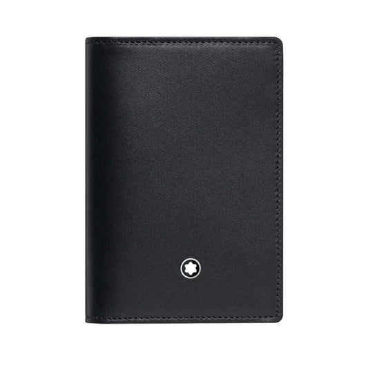 The Montblanc Meisterstück Leather Business Card Holder, from the esteemed brand Montblanc, is a compact and minimalist accessory crafted from sleek black leather. It features a small, round white emblem at the bottom center and includes credit card slots inside. Its smooth texture adds to its sophisticated look.