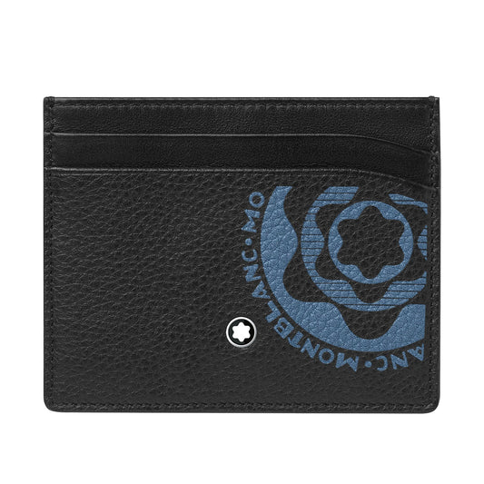 The Montblanc Meisterstück Soft Grain Blue Leather Card Holder, by Montblanc, is crafted from soft grain leather and features a textured surface with a blue logo prominently displayed on the front. It offers multiple card slots and includes a small emblem positioned at the bottom center.