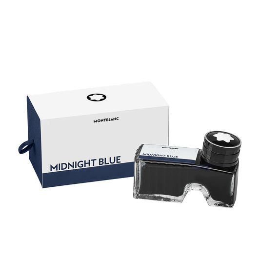 The Montblanc Ink Bottle 60ml in "Midnight Blue" is elegantly showcased with its packaging. The bottle is transparent and adorned with a sleek black cap, while the minimalist box features a sophisticated design in white and blue.