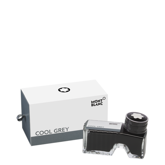 A Montblanc Ink Bottle 60ml Cool Grey and its box are displayed on a white background. The clear bottle with black cap sits next to the mostly white box, which has gray sides and “COOL GREY” text.